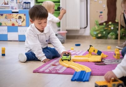 Students playing with toys