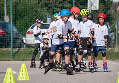 Students rollerblading outside
