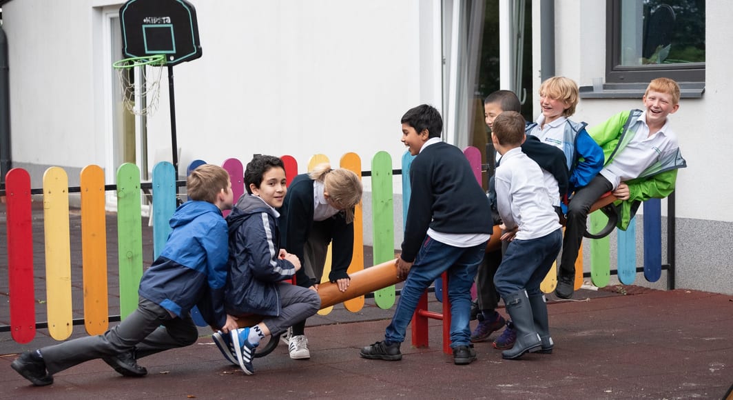 Students playing on playground in school