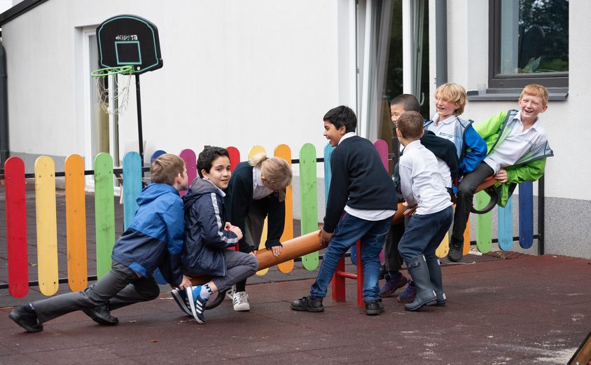 Students playing on playground in school