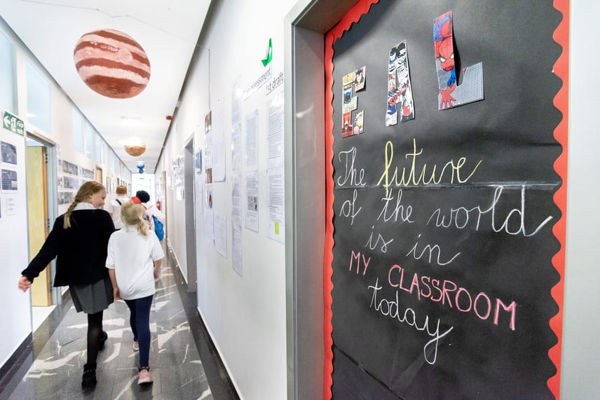 School hall with students walking