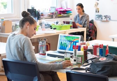 Student painting in school